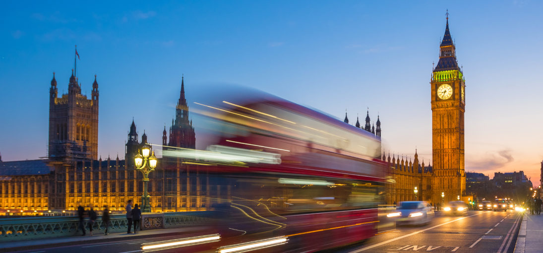 Iconic Double Decker bus with Big Ben and Parliament at blue hour, London, UK
