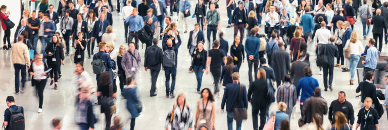 Blurred image of large crowd of people