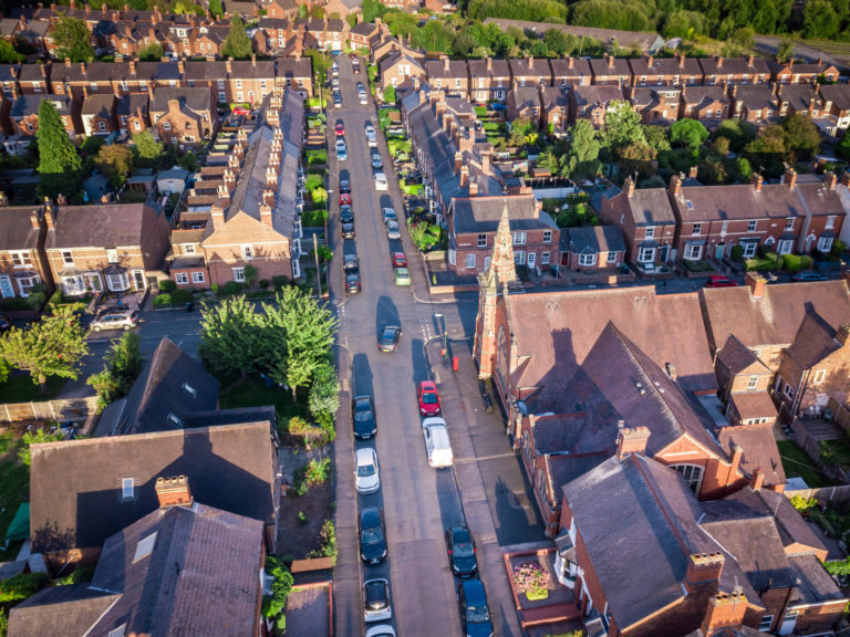 View of streets and houses British residential area from the air.