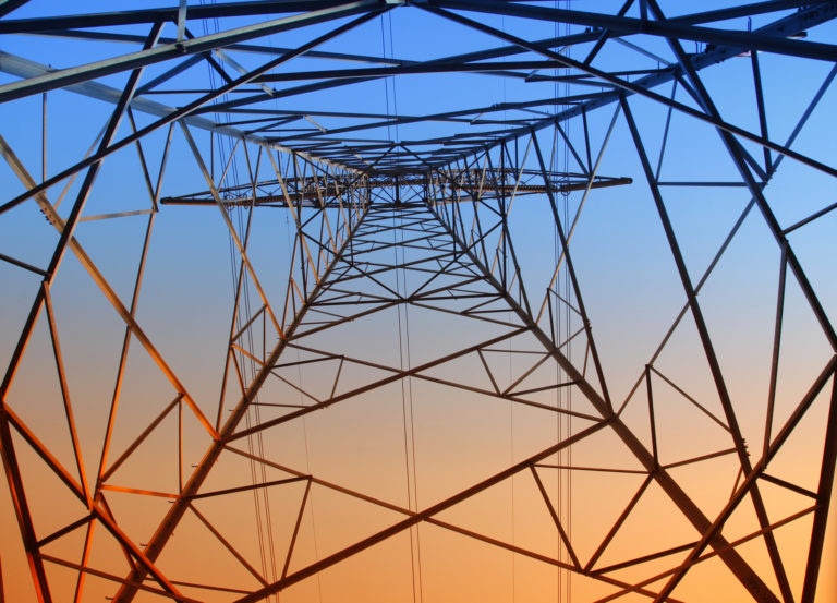An electricity pylon viewed from underneath
