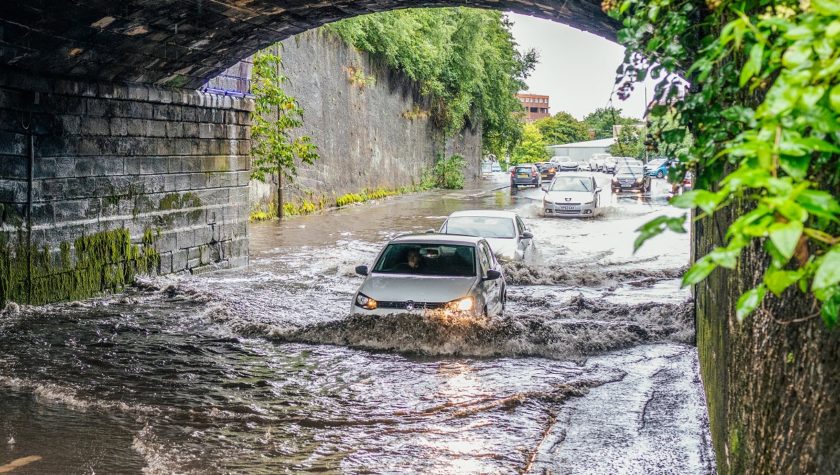 Car driving through floodwater