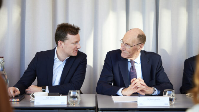 Seb Dance and Sir John shown seated together during the meeting