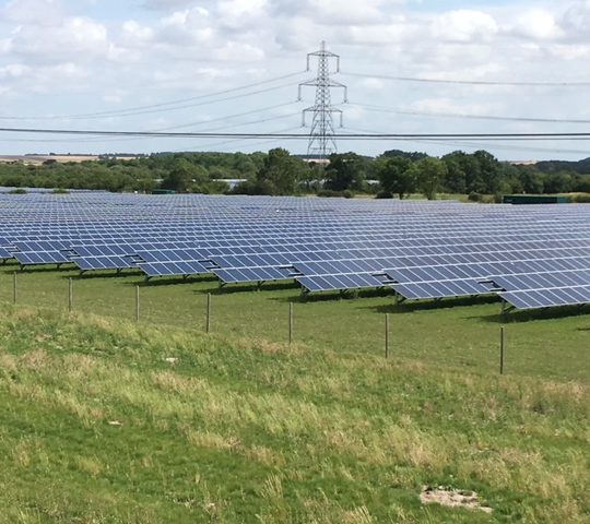 A solar farm in a field