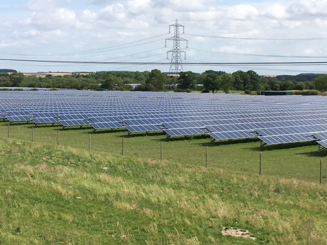 A solar farm in a field