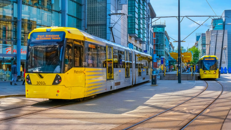 A Metrolink tram on the streets of Manchester England