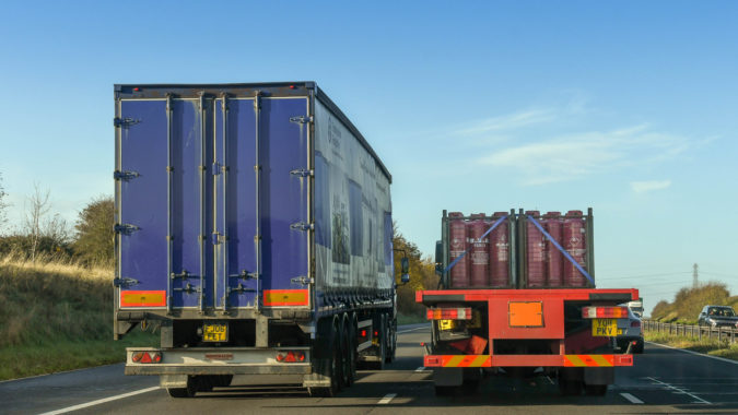 Articulated lorry overtaking another lorry on a motorway