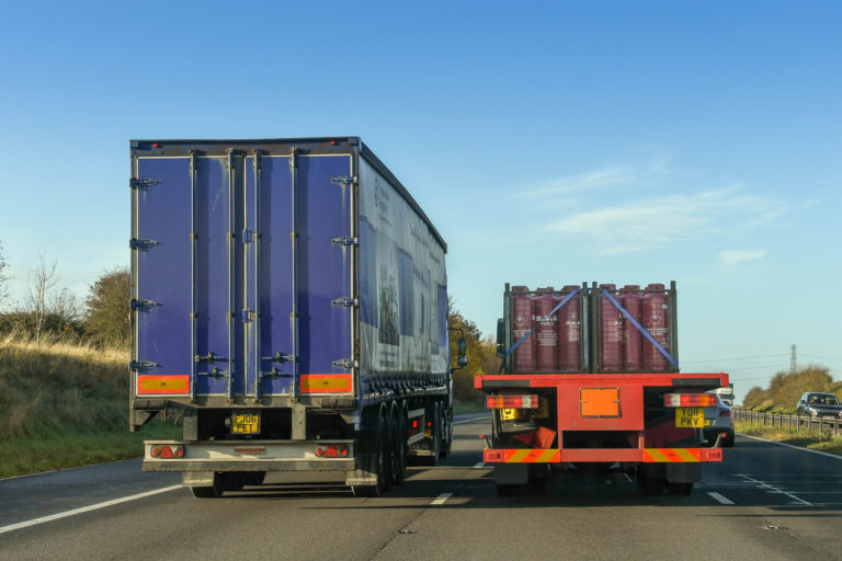 Articulated lorry overtaking another lorry on a motorway