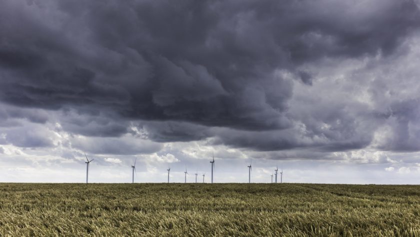 Wind turbines against a stormy sky