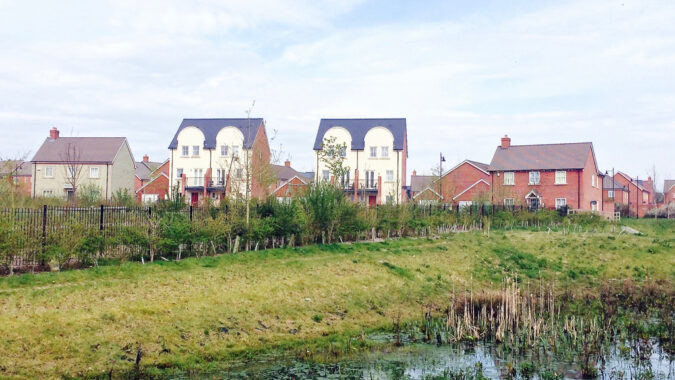 New housing estate on the outskirts of a rural Dorset town. View from the sustainable urban drainage