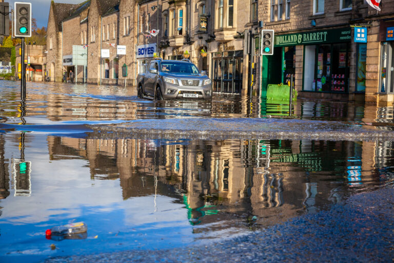 Car driving through floodwater