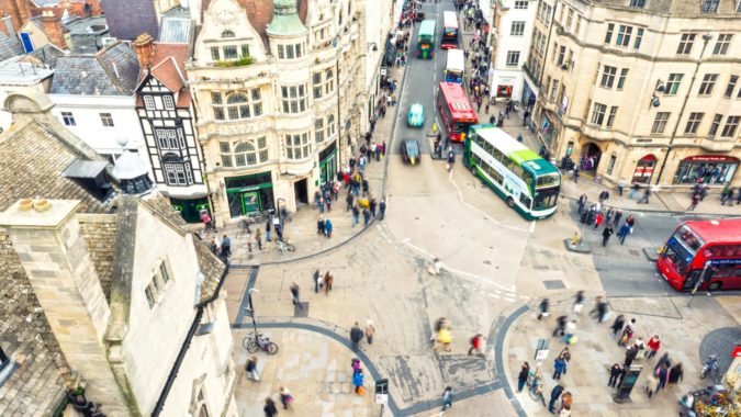 Ariel view of a city with people and buses