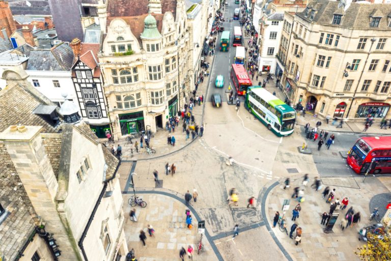 Ariel view of a city with people and buses